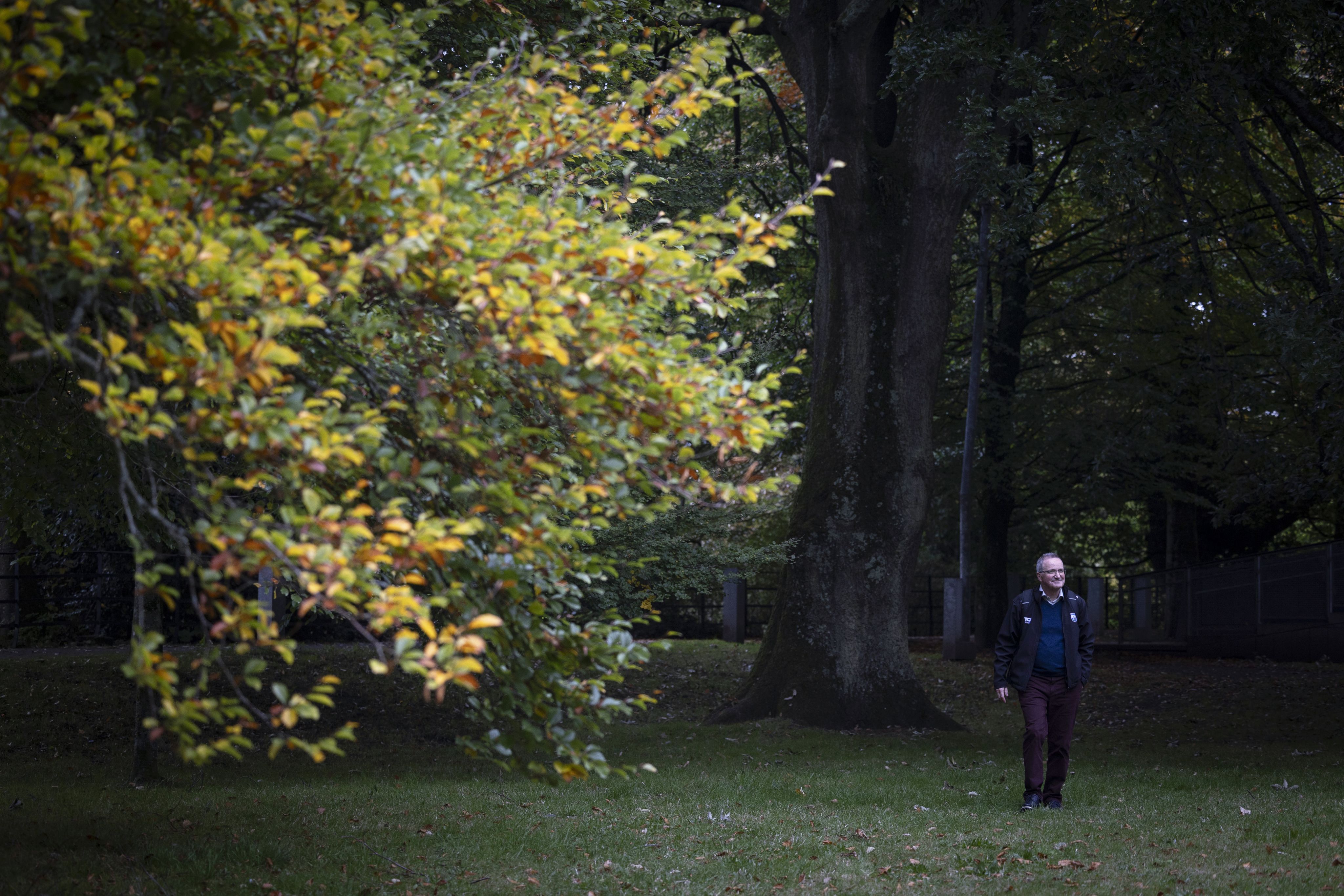 Paul Bolger walking leafy campus of UCC